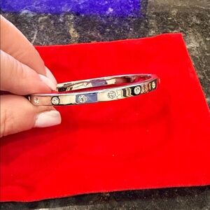 Kate Spade Love click bracelet. Silver tone. Diamond-like stones.